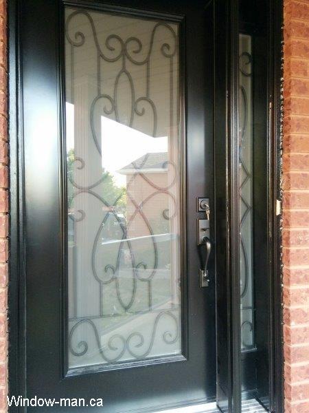 Front door one sidelight. Steel insulated front exterior entry. Black. Full wrought iron glass inserts. Nottingham glass design